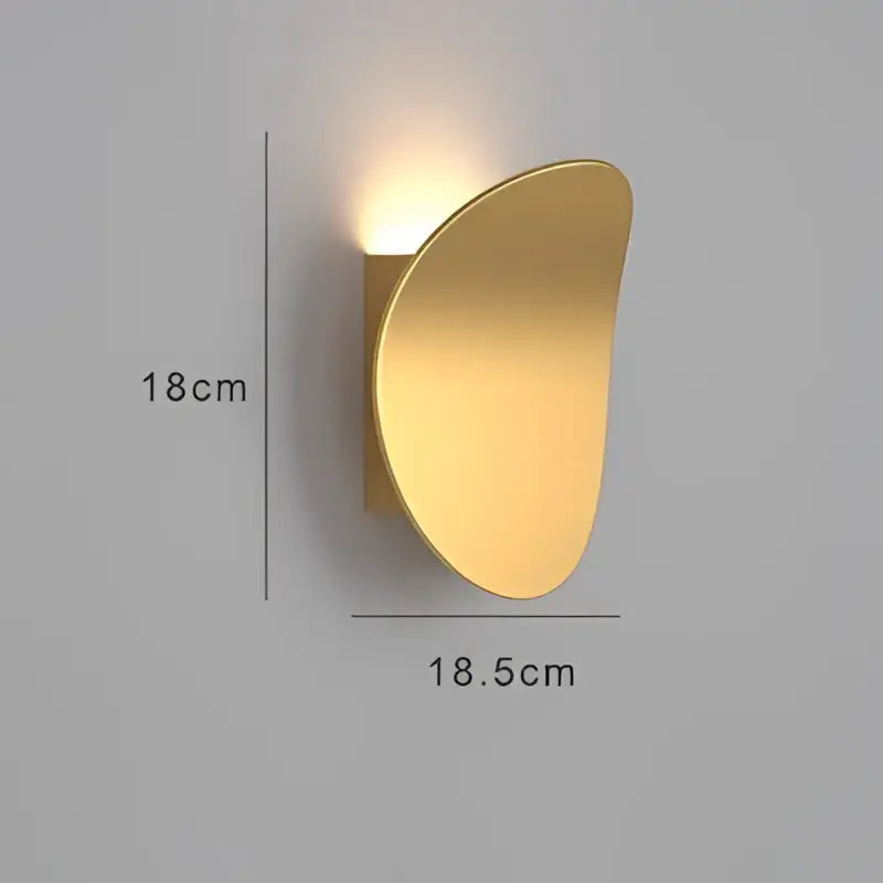 Gold-colored sleek curved decorbites led indoor wall lamp with modern minimalist design for living room and bedside lighting