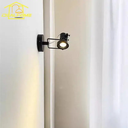 Black metal decorbites led industrial wall lamp with adjustable arm emitting warm light for led industrial bedroom use