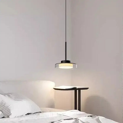 Minimalist black decorbites led iron acrylic pendant with circular glass shade emitting warm light for bedroom and living room