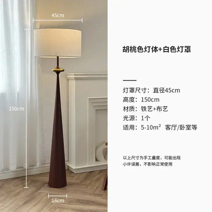 A sleek 150cm tall decorbites led iron floor lamp with a dark walnut iron base and white fabric shade for living room