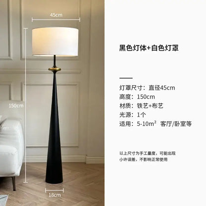 A sleek black DecorBites LED iron floor lamp with white fabric shade and gold accent for living room and bedroom