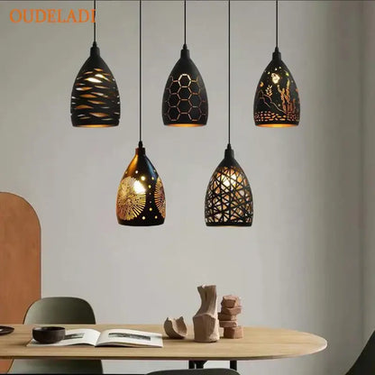 Five black ceramic pendant lights with intricate gold cutouts hang ceiling decorbites led iron cage pendant light