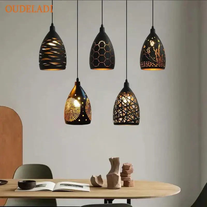 Five black ceramic pendant lights with intricate gold cutouts hang ceiling decorbites led iron cage pendant light