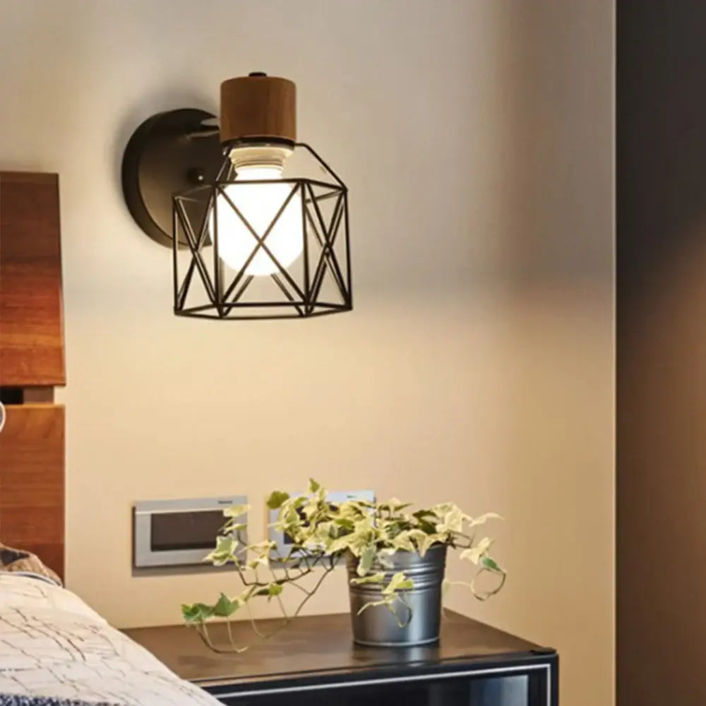 Industrial-style wall light with black metal geometric cage wooden top cap and exposed bulb by decorbites led iron cage