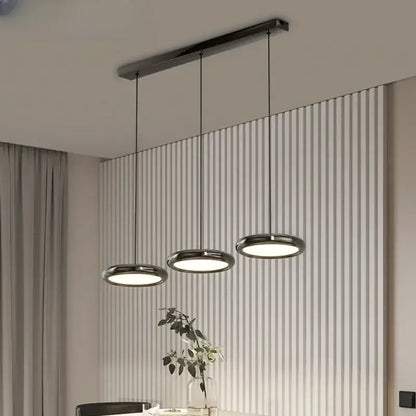Modern minimalist decorbites led iron pendant light with three chrome lamps suspended from a black rectangular bar