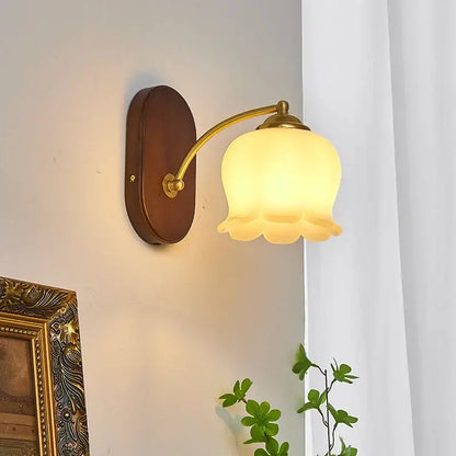 Warm-toned frosted glass bell-shaped decorbites led japanese style wall lights with brass arm and dark wood backplate