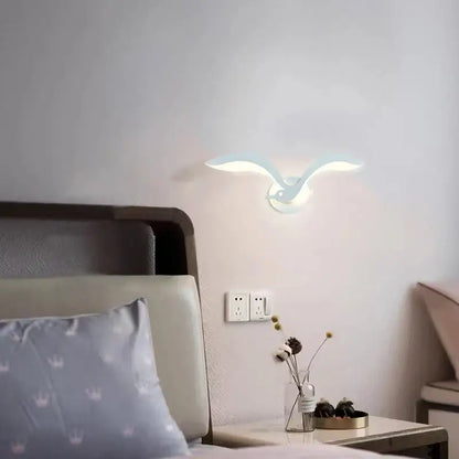 A sleek white seagull-shaped wall sconce with modern design by decorbites led jellyfish for indoor use