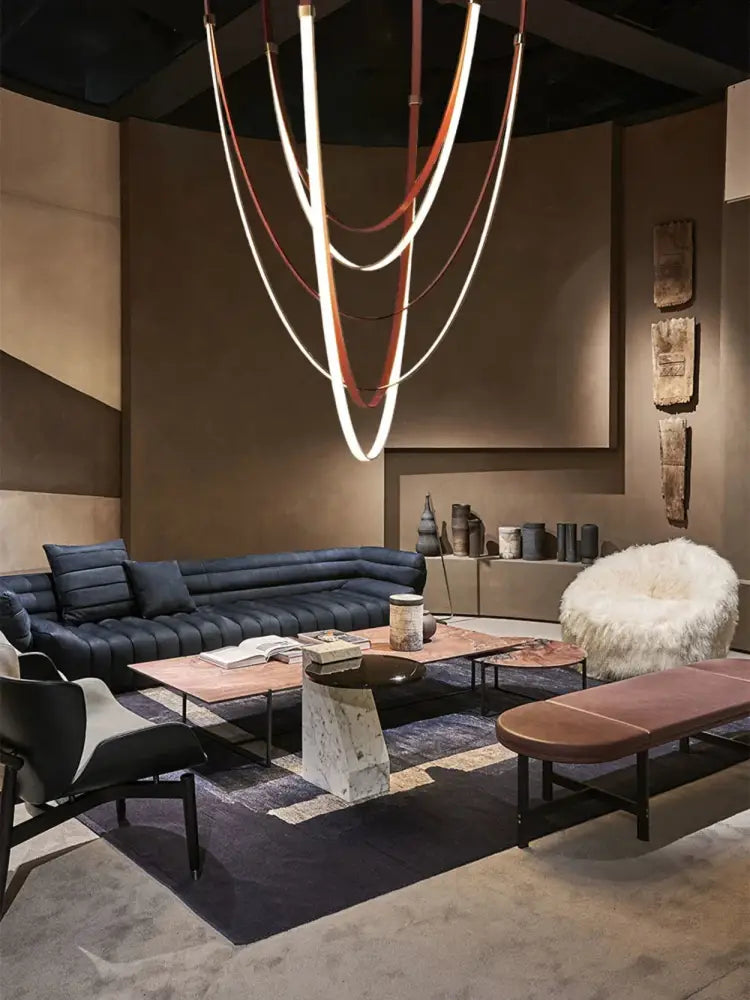 A modern DecorBites LED leather belt chandelier with intertwined white and brown bands for living room decor