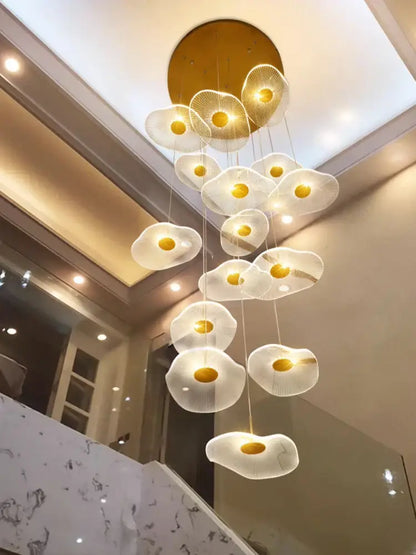 A DecorBites LED lotus sculptural chandelier with translucent white egg-shaped lights and gold centers for staircases