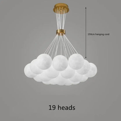 White cloud-shaped DecorBites chandelier with 19 frosted glass globes and gold-toned fixture for home decor lighting