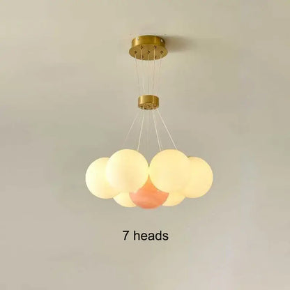Gold-finished decorbites led lunar ceiling fixture with seven frosted glass orbs for living and bedroom lighting