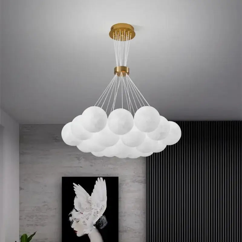 White cloud-shaped DecorBites LED Lunar pendant light with gold ceiling mount and spherical glass orbs for home decor lighting