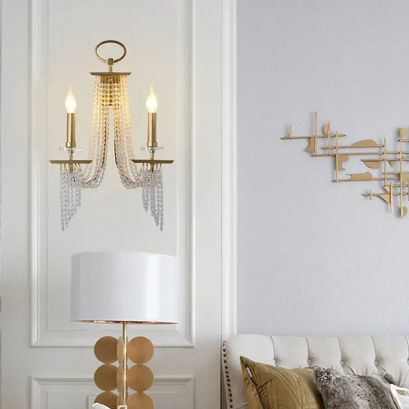Gold-toned decorbites led lustres wall sconce with two candle-style bulbs and cascading crystal chains for elegant decor