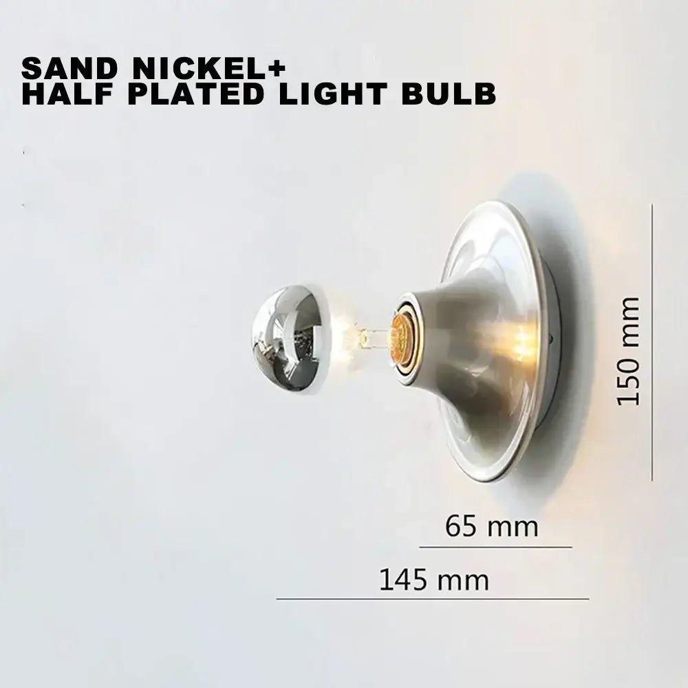 A sleek sand nickel half-plated decorbites led macaron wall lamp with reflective head and warm illumination