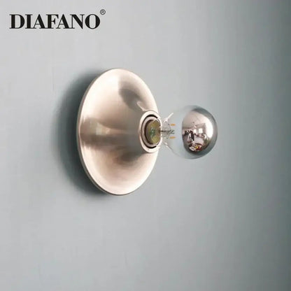 Diafano decorbites led macaron wall lamp with brushed metallic finish and clear glass bulb for colorful bedroom lighting