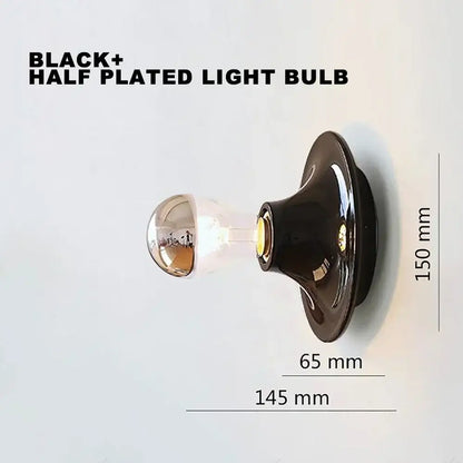 Black half-plated decorbites led macaron wall lamp with reflective glass globe and metallic base for bedroom lighting
