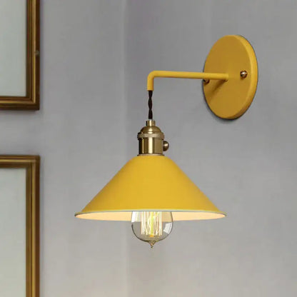 Yellow industrial-style wall light with brass accents and visible filament bulb from decorbites led macarons colorful series