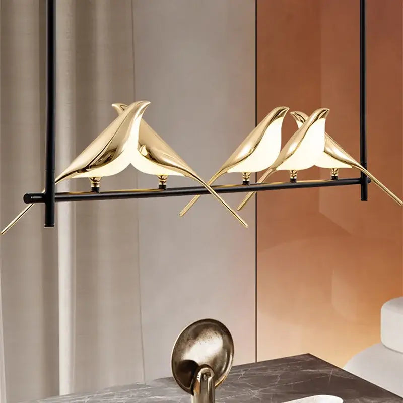 Gold-colored sleek decorbites led magpie pendant light shaped like a bird for modern living and dining room decor