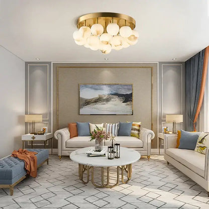 Gold-toned DecorBites LED marble balls chandelier with multiple spherical glass bulbs for dining room lighting
