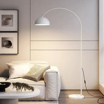 White arched floor lamp with curved metal frame and dome shade featuring decorbites led marble base for modern rooms