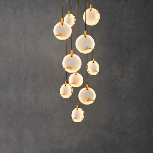 Modern chandelier with translucent white opal discs and gold-toned hardware decorbites led marble gold chandelier