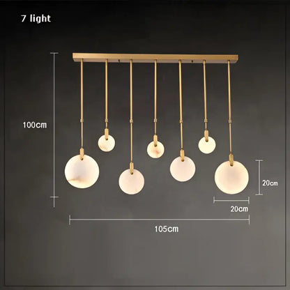 Decorbites led marble gold chandelier featuring seven frosted glass globes on a gold-toned modern horizontal bar
