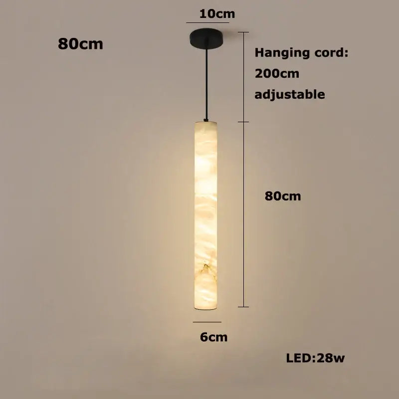 A warm beige cylindrical decorbites™ led marble hanging lamp with white alabaster texture for ambient lighting