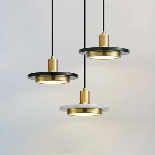 Modern DecorBites LED marble pendant light with gold-toned metal fixtures and black and white circular discs for luxury decor