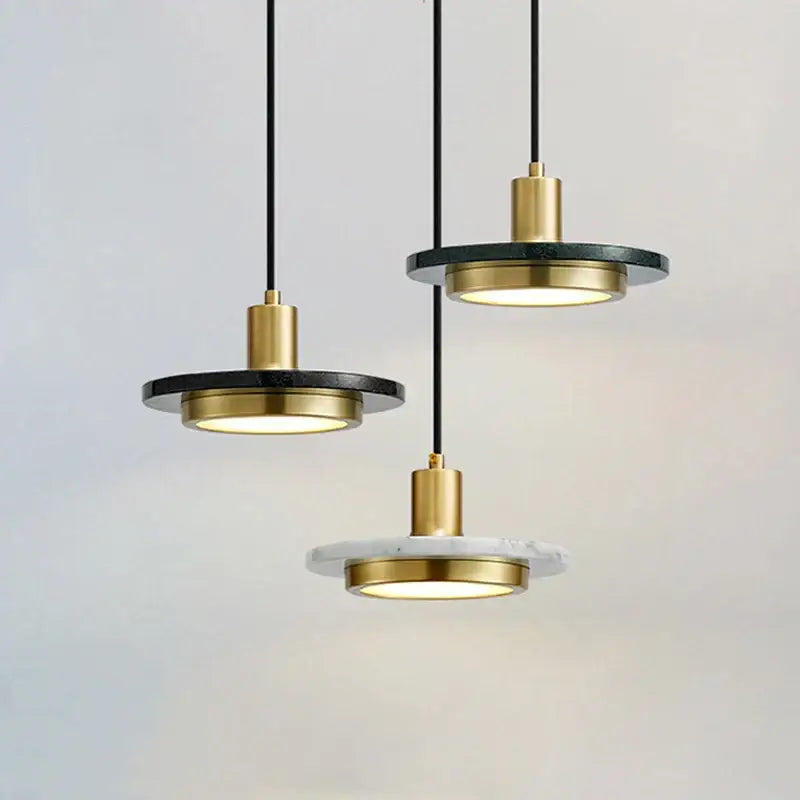 Modern decorbites led marble pendant light with black marble disc and polished brass accents for dining and bedroom use