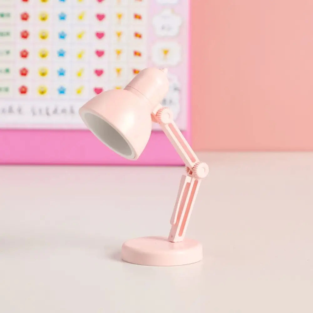Pastel pink decorbites led mini desk lamp with adjustable matte plastic body and articulated arm for bedroom night light