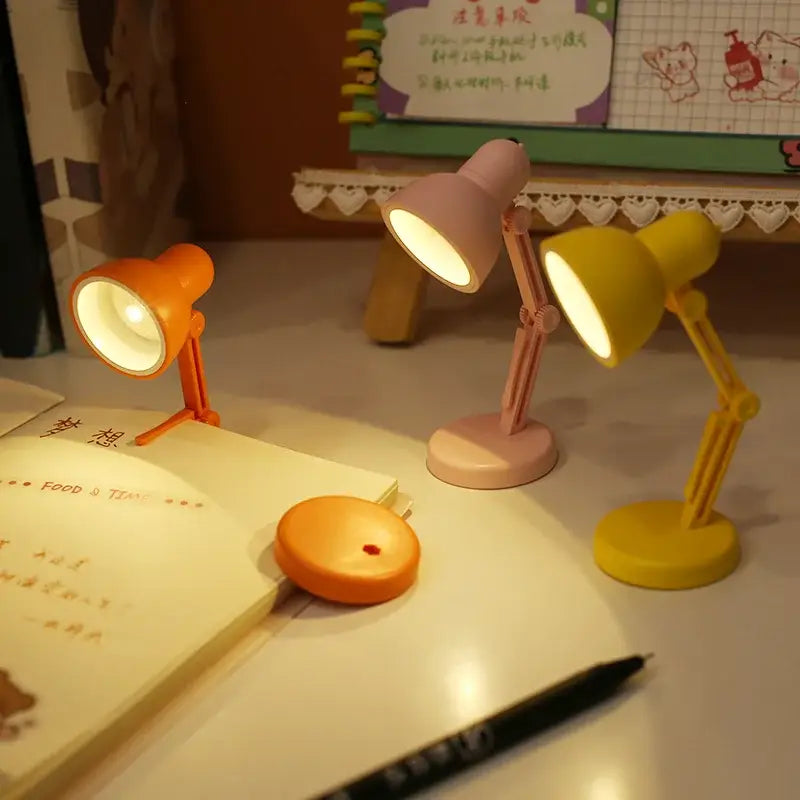 Three decorbites led mini desk lamps in orange pink and yellow plastic with clip foldable design and magnetic base