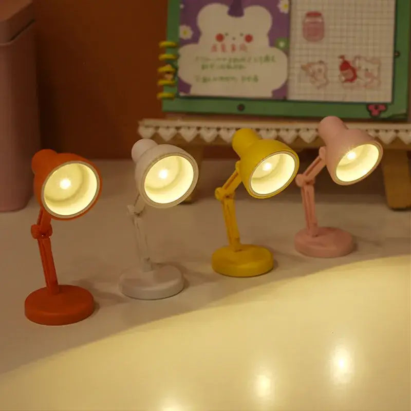 Four decorbites led mini desk lamps in orange white yellow and pink with adjustable arms foldable design and magnetic base