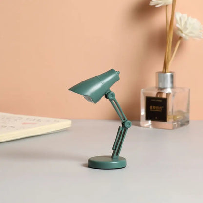Teal decorbites led mini desk lamp with articulated arm, adjustable head, foldable design, and magnetic base for study use
