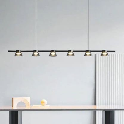Modern black linear pendant lights with five warm spotlight fixtures for kitchen island by DecorBites led minimalist
