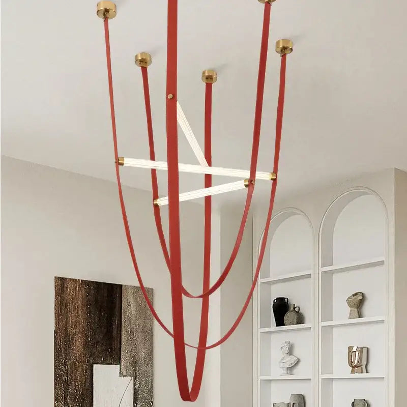 Red leather strap pendant lamp with brass hardware and integrated LED tubes from DecorBites LED minimalist chandelier series
