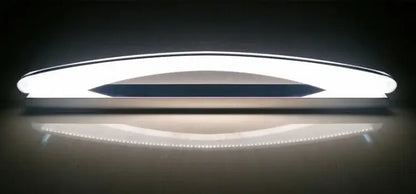 Modern white DecorBites LED mirror light fixture with sleek curved design and central dark accent strip for makeup bathrooms