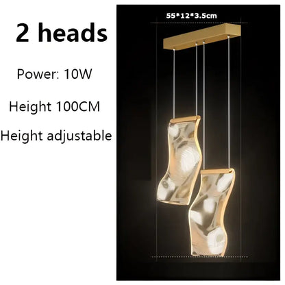 Gold-toned decorbites led modern ceiling chandelier with two sculptural heads suspended by thin cords for living spaces
