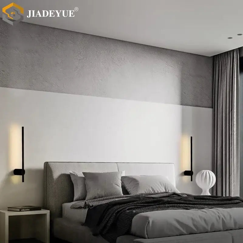 Modern black DecorBites LED modern wall lamp with sleek vertical design and warm light emission for bedroom decor