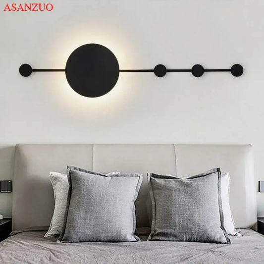 Black minimalist decorbites led moon wall lamp with circular lights on an elongated bar for home ambiance
