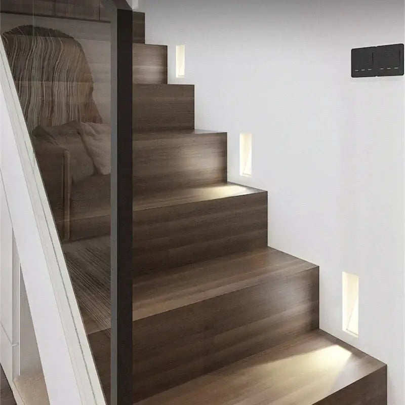 Modern wooden staircase with sleek dark brown steps illuminated by decorbites led motion sensor wall lamp
