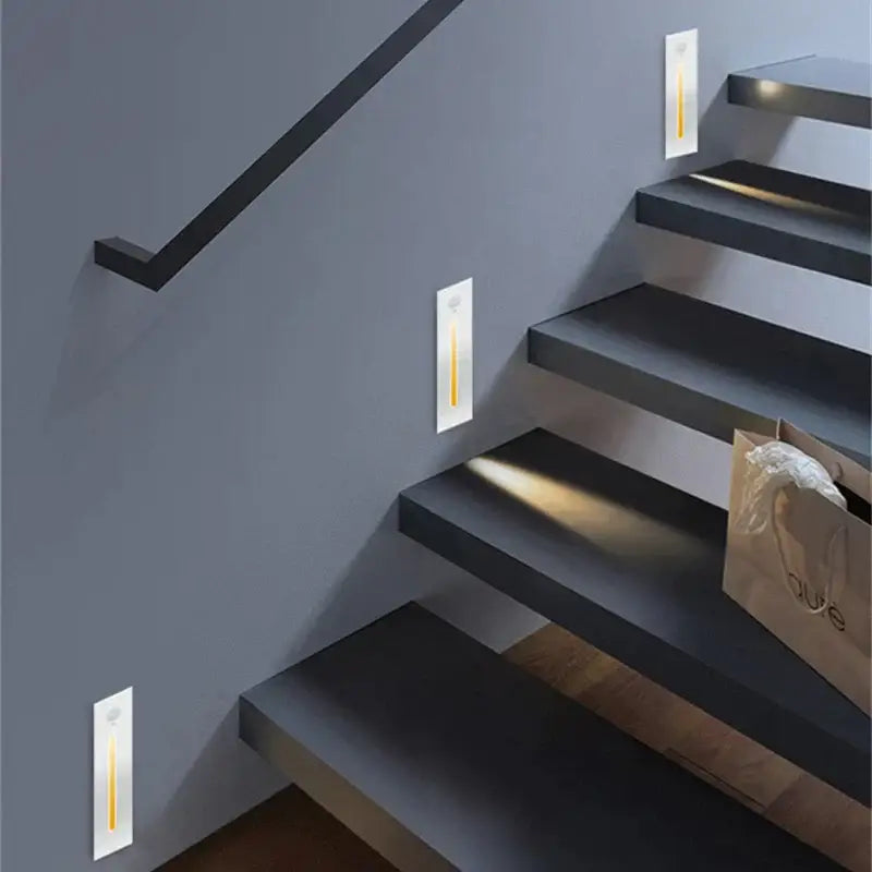 Modern minimalist decorbites led motion sensor wall lamps with white rectangular bodies and warm yellow led strips