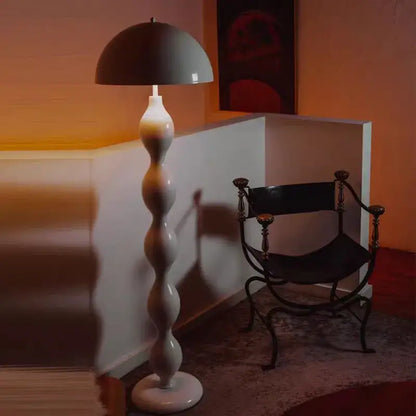 A sleek decorbites led mushroom floor lamp with matte gray dome shade and white twisted base for living room use