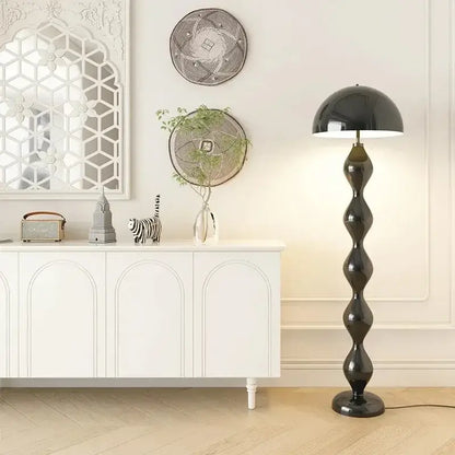 A sleek black DecorBites™ led mushroom floor lamp with a glossy twisted stem and dome-shaped shade for living rooms