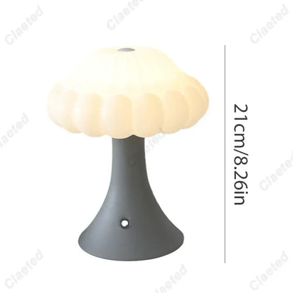 A cream-colored decorbites led mushroom night light with a matte gray base and touch switch for kid’s room decor