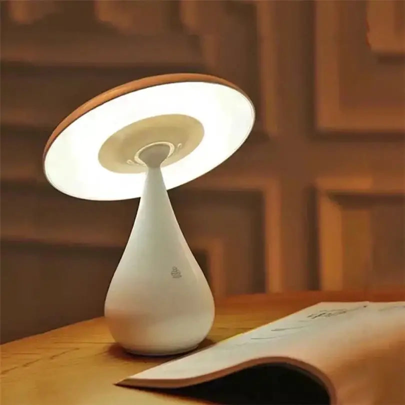 A sleek white decorbites led mushroom table lamp with warm circular led light and wooden rim for bedroom decor