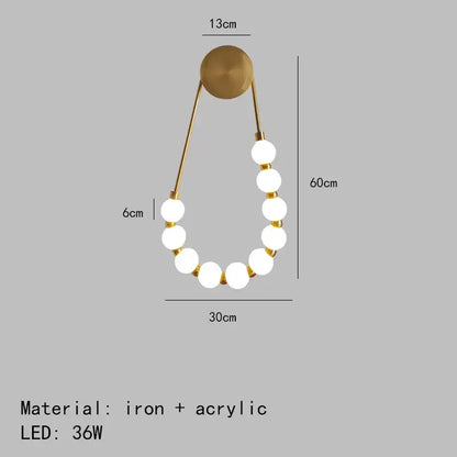 Gold-toned decorbites led necklace wall light with seven white acrylic bulbs on black metal arms for home art deco decor
