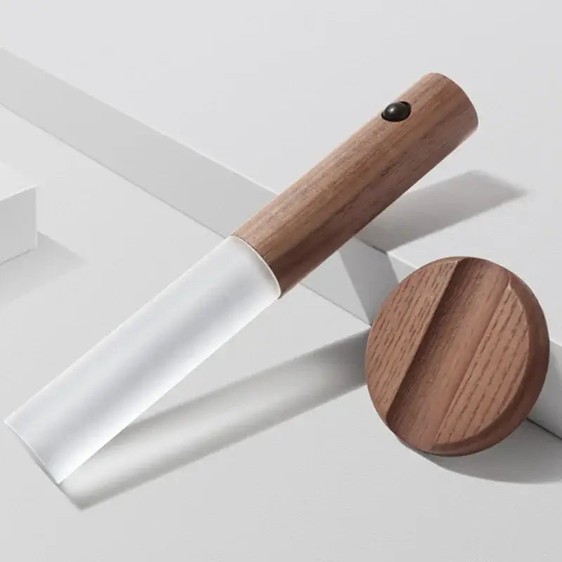 Wooden-handled garden trowel with translucent white plastic blade and cap shown alongside decorbites led night light product