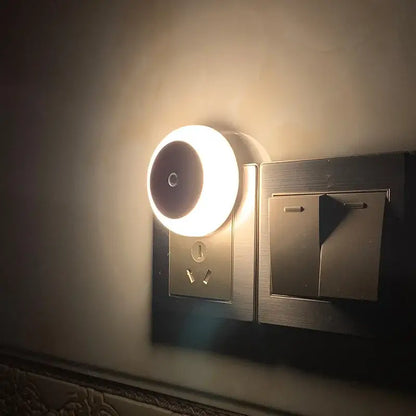 A sleek circular decorbites led night light with warm glow and smart sensor for bedroom hallway use