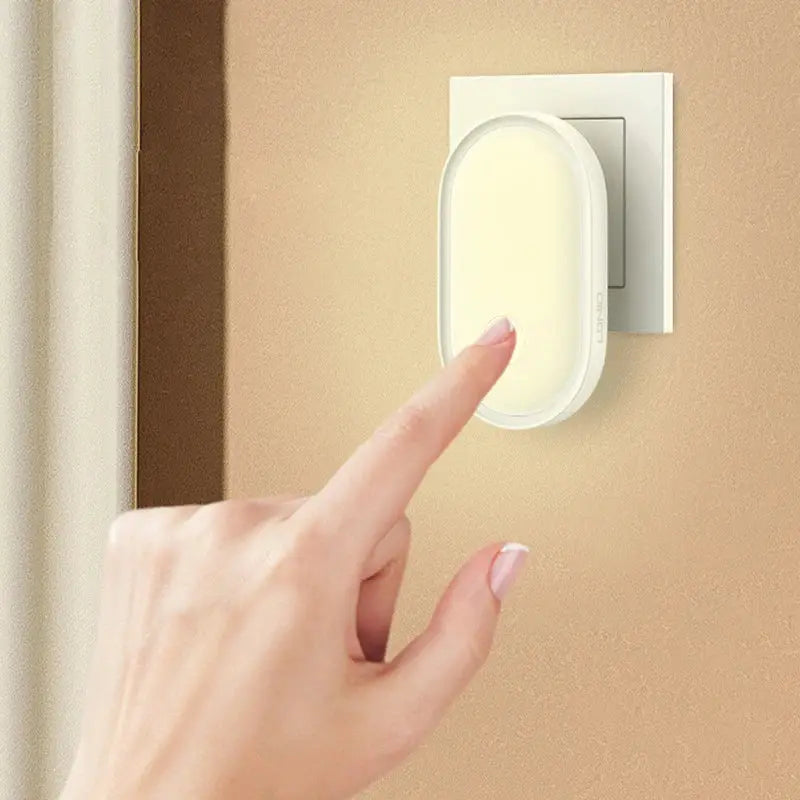 White oval-shaped DecorBites led night light with smooth matte finish and light control induction for bedroom use