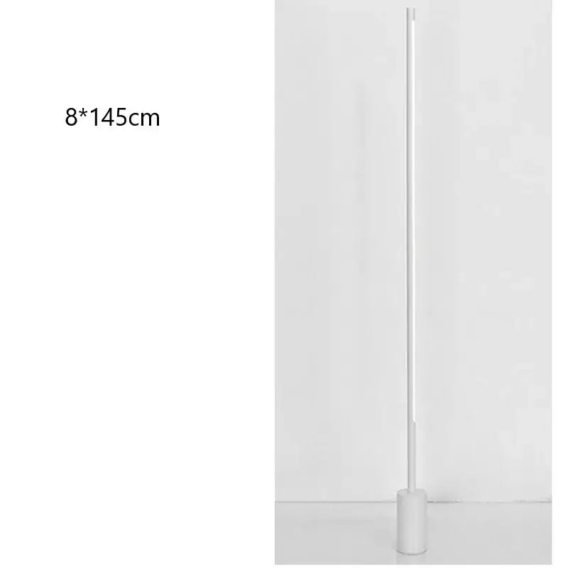 A sleek minimalist white floor lamp with a slender cylindrical body and circular base decorbites led nordic floor lamp